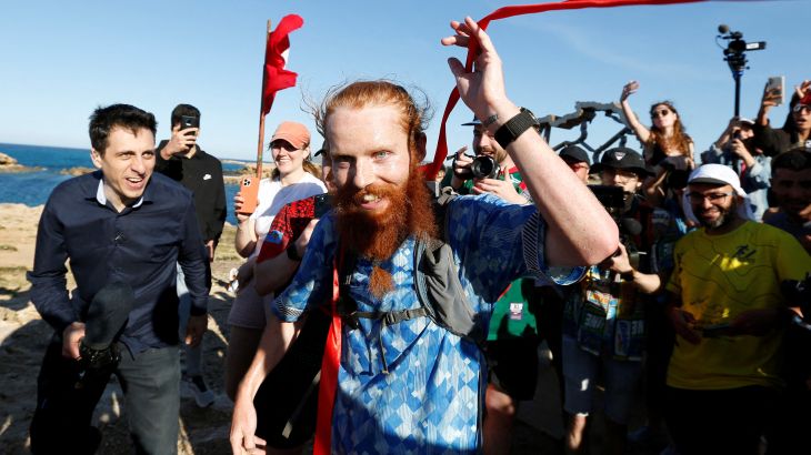 Britain's Russ Cook becomes the first person to run the entire length of Africa - Tunisia - April 7, 2024 Britain's Russ Cook reacts after becoming the first person to run the entire length of Africa.