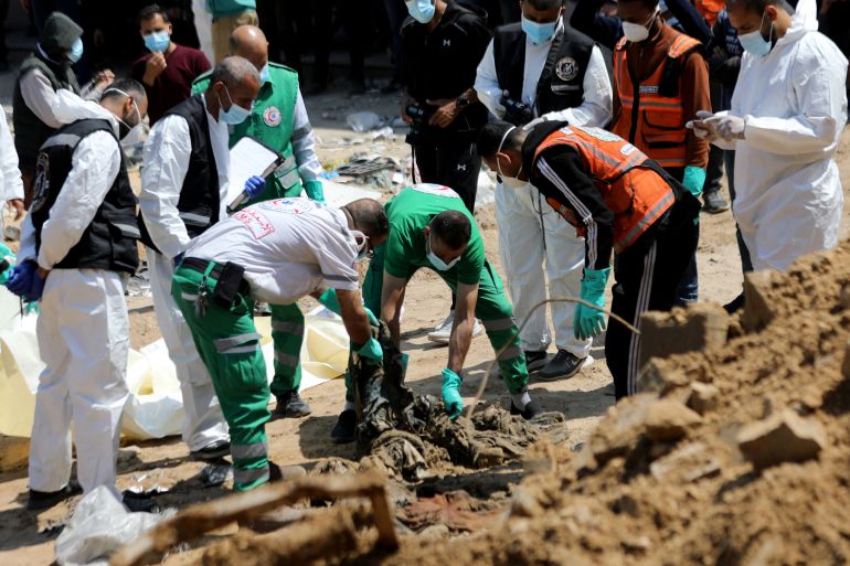Rescuers and medics search for dead bodies inside the damaged Al Shifa Hospital after Israeli forces withdrew from the hospital and the area around it following a two-week operation