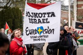 People hold a banner that reads &#039;Boycott Israel, Eurovision Song Contest, Malmo 2024,&#039; in Malmo, Sweden [Johan Nilsson/TT News Agency/via Reuters]