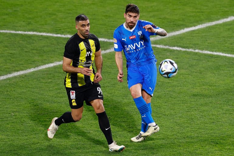 Abderrazak Hamdallah (left) and Ruben Neves content the ball.
