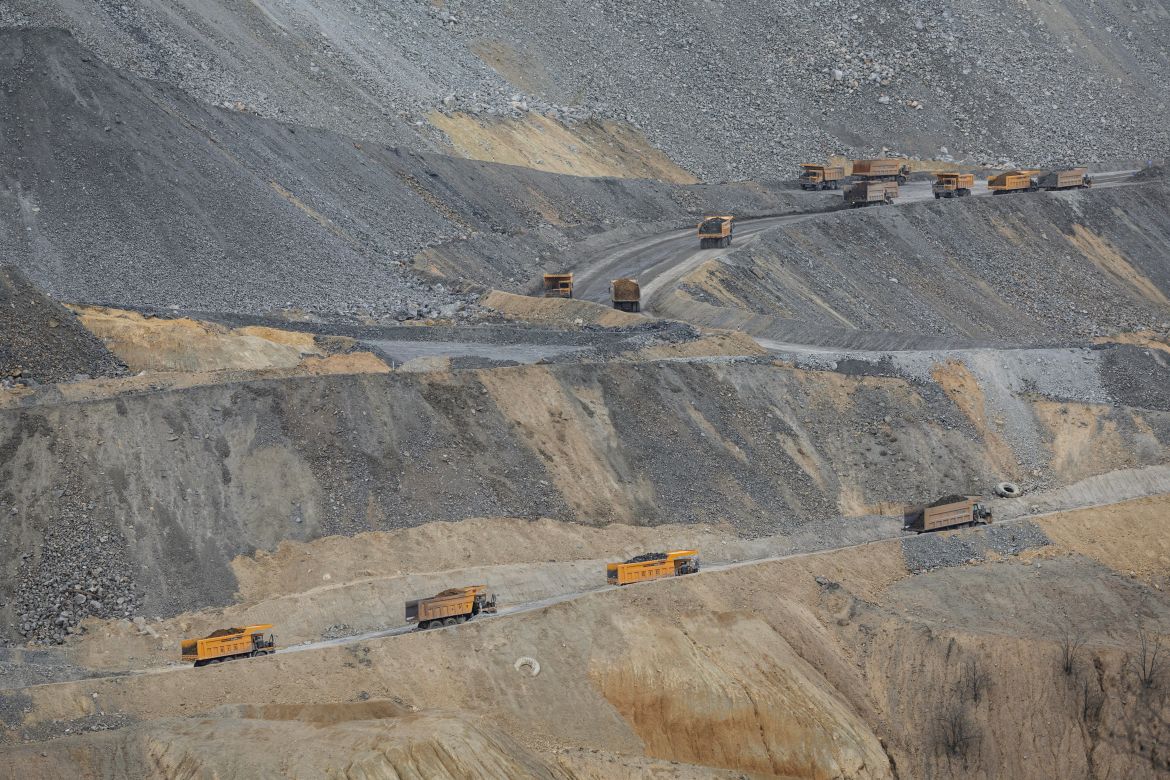 Trucks work at an open-pit copper mine, run by a subsidiary of China's Zijin Mining, near the village of Krivelj, Serbia, April 3