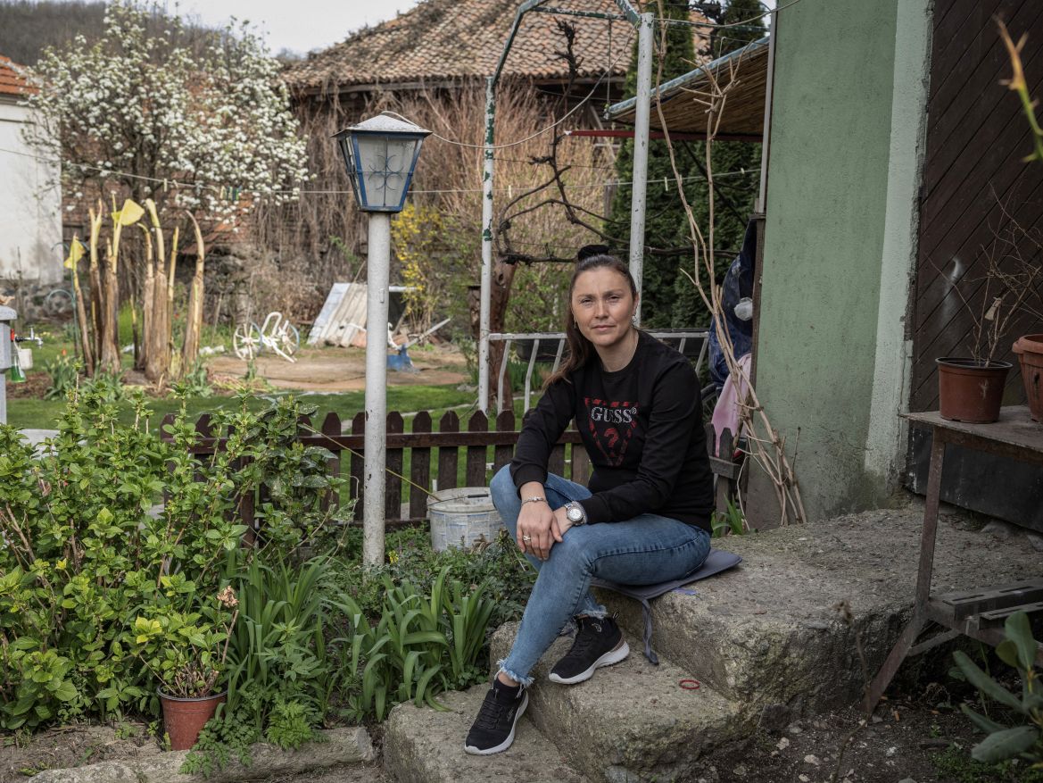 Natasa Kostandinovic, 39, who is a housewife, poses for a picture in the garden of her family house in the village of Krivelj, Serbia, April 3, 2024