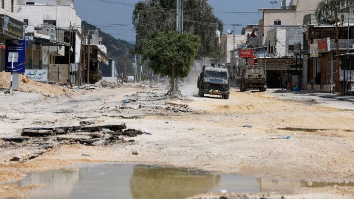 An Israeli military vehicle drives during a raid, at Nour Shams camp, in Tulkarm, in the Israeli-occupied West Bank, April 19, 2024. [Raneen Sawafta/Reuters]