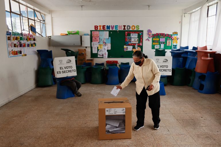 A woman takes part in a referendum in Ecuador