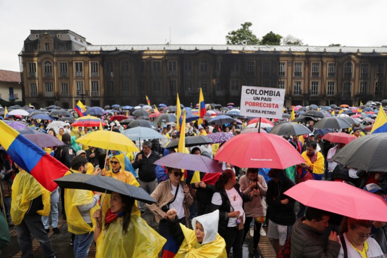 Demonstrators protest against Colombian President Gustavo Petro's reforms in the health, retirement, employment and prison sectors, in Bogota, Colombia April 21, 2024. REUTERS/Luisa 