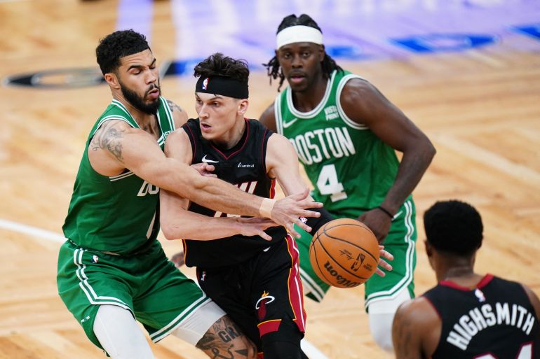 Apr 24, 2024; Boston, Massachusetts, USA; Miami Heat guard Tyler Herro (14) drivers the ball against Boston Celtics forward Jayson Tatum (0) in the second half during game two of the first round for the 2024 NBA playoffs at TD Garden. Mandatory Credit: David Butler II-USA TODAY Sports