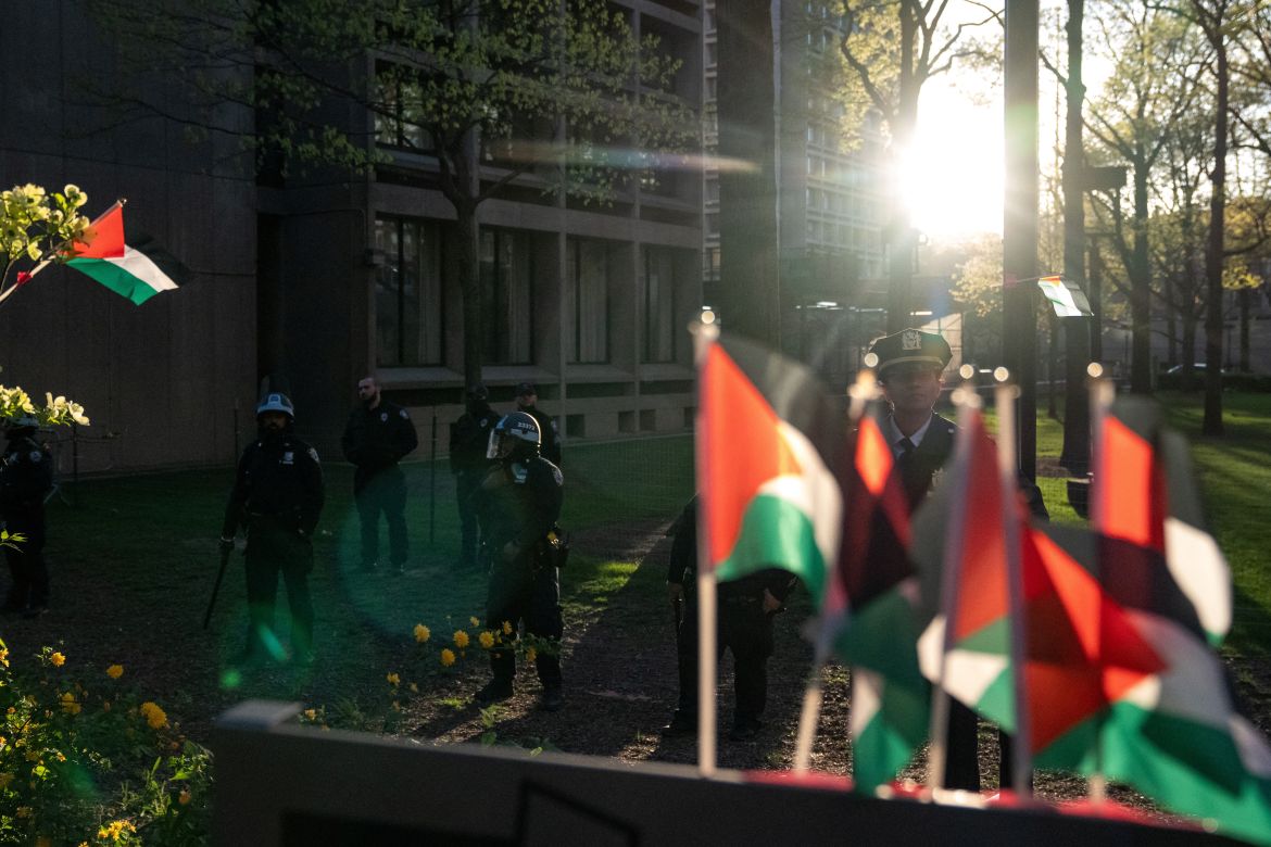 Law enforcement officers stand guard as students and pro-Palestinian supporters occupy a plaza at New York University (NYU) campus, during the ongoing conflict between Israel and the Palestinian Islamist group Hamas, in New York City, U.S., April 26