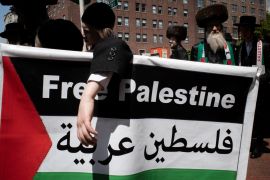 Members of the Orthodox Jewish community advocate for a free Palestine at the gates of Columbia University in New York City [File: David Dee Delgado/Reuters]