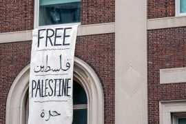 A person stands near a window with a “Free Palestine” banner at Hamilton Hall at Columbia University, which student protesters barricaded, despite orders from university officials to disband or face suspension, during the ongoing conflict between Israel and the Palestinian Islamist group Hamas, in New York City, U.S., April 30, 2024. REUTERS/David Dee Delgado