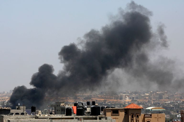 Smoke rises as the Israeli forces raid the Nuseirat refugee camp in Deir Al Balah, Gaza on April 12