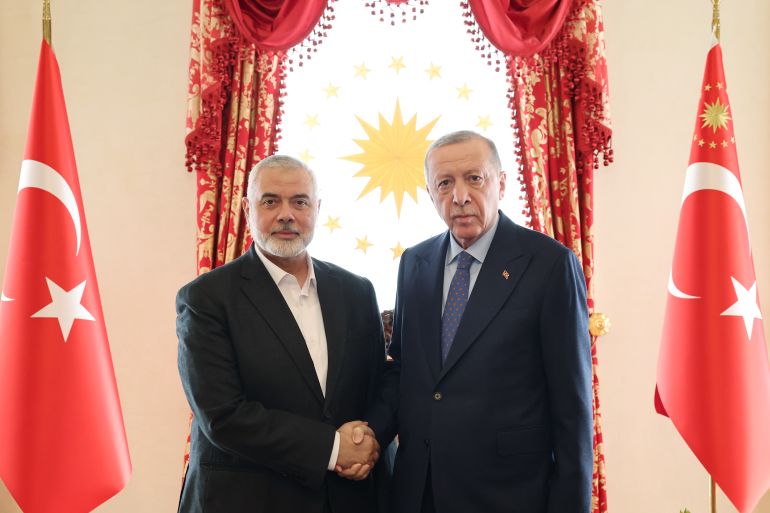 Turkish President Recep Tayyip Erdogan (R) meets with Hamas Political Bureau Chairman Ismail Haniyeh at Dolmabahce Palace working office in Istanbul, Turkiye on April 20