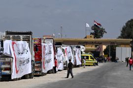 Egyptian Red Crescent trucks loaded with aid queue outside the Rafah border crossing with the Gaza Strip, amid ongoing humanitarian crisis in the Palestinian territory [File: Khaled Desouki/AFP]