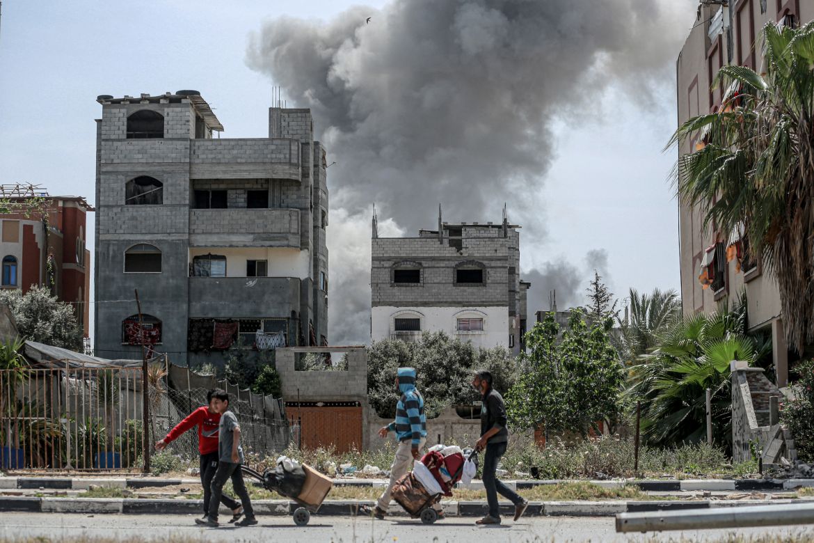 Smoke billows after an Israeli strike on a building in al-Bureij camp in the central Gaza
