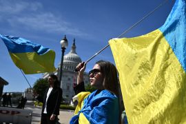 Activists wave Ukrainian flags outside the US Capitol [Mandel Ngan/AFP]