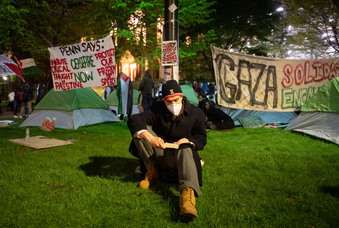 Pro-Palestinian students and faculty of Drexel University, Temple University and the University of Pennsylvania demonstrate as they spend night where they erected an encampment at the University of Pennsylvania campus in Philadelphia on April 25