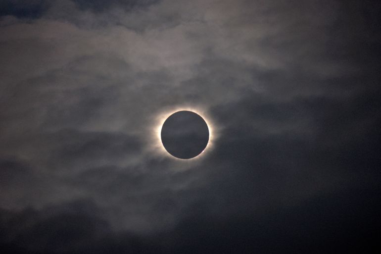 total eclipse in a dark cloudy sky