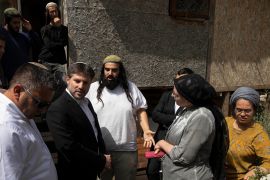 Bezalel Smotrich, second from left, visits the Sheikh Jarrah neighbourhood of occupied East Jerusalem on May 10, 2021. Plans are under way to evict Palestinian families from their homes in Sheikh Jarrah to give them to Israeli settlers [Sebastian Scheiner/AP Photo]