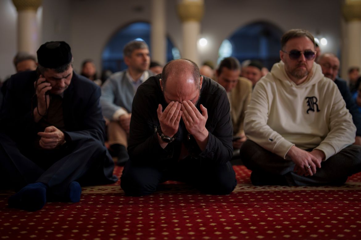 Muslims perform an Eid al-Fitr prayer, marking the end of the fasting month of Ramadan