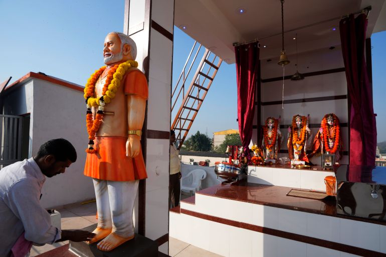 Mohanlal Gupta, a scrap trader, worships a statue of Indian Prime Minister Narendra Modi at a temple he has built on the third floor of his residential building at Gadkhol village near Ankleshwar in Baruch district of Gujarat state,