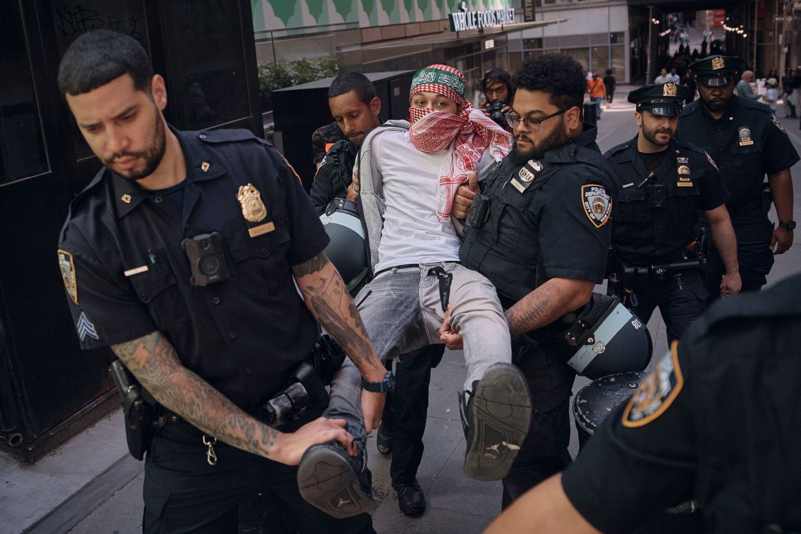 Police arrest a protester during a pro-Palestinian demonstration calling for an economic blockade and demanding a cease-fire on the Israel-Palestinian conflict outside The New York Stock Exchange on Monday, April 15