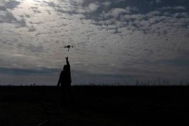 A Ukrainian serviceman catches a drone at the front line, not far from Bakhmut [Alex Babenko/AP Photo]