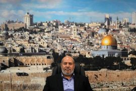 Khalil al-Hayya, a high-ranking Hamas official who has represented the Palestinian group in negotiations for a ceasefire and captive exchange deal in Gaza, sits in front of a backdrop showing the old city of Jerusalem in Istanbul, Turkey, on April 24, 2024 [Khalil Hamra/AP Photo]