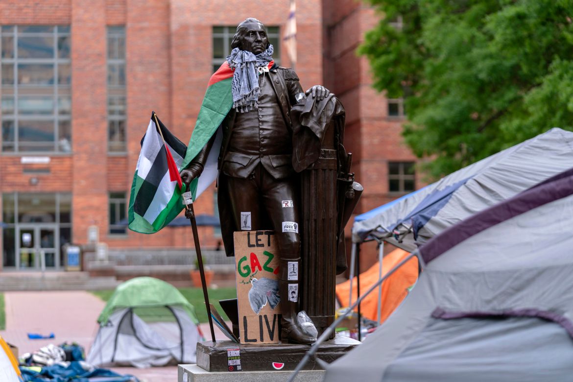 A statue of George Washington draped in a Palestinian flag and a keffiyeh is seen at George Washington University as students demonstrate on campus during a pro-Palestinian protest over the Israel-Hamas war on Friday, April 26