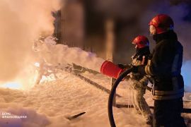Emergency services personnel work to extinguish a fire in Ivano-Frankivsk region, Ukraine, on Saturday [Handout/State Emergency Service of Ukraine via AP]