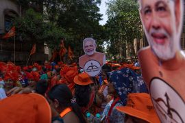 Supporters of Indian PM Narendra Modi during a road show in Mumbai on April 29, 2024 [Rafiq Maqbool/AP]