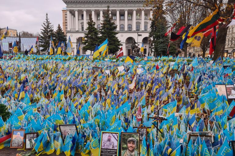 Flags and photos with the names of fallen Ukrainian servicemen on Independence Square in Kyiv-1712916864