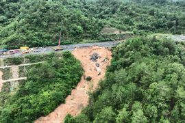The road collapsed in the early hours of Wednesday [Wang Ruiping/Xinhua via EPA]