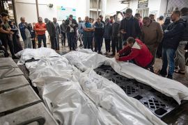 Relatives of Palestinians killed during an Israeli air strike mourn next to their wrapped bodies outside Al-Najjar Hospital in Rafah, southern Gaza Strip [EPA-EFE/HAITHAM IMAD]