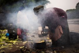 According to the International Energy Agency, 2.3 billion people across 128 countries breathe in harmful smoke when they cook on basic stoves or over open fires [File: Adrees Latif/Reuters]