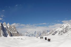 Trekkers hike down the Baltoro glacier in the Karakoram mountain range in Pakistan [Wolfgang Rattay/Reuters]