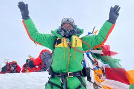 Kami Rita is pictured on the summit of Mount Everest during his 28th summit in Everest on May 23, 2023 [Handout/Kami Rita Sherpa via Reuters]