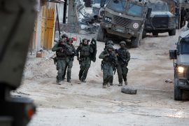 Israeli soldiers during a raid, at Nour Shams refugee camp in Tulkarm in the occupied West Bank, April 20, 2024 [File: Raneen Sawafta/Reuters]