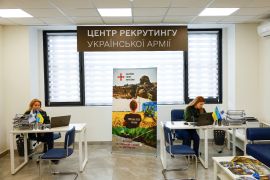 Employees of a newly opened Ukrainian Army recruitment centre wait for potential troops to sign up, amid Russia&#039;s attack on Ukraine, in Dnipro [File: Valentyn Ogirenko/Reuters]