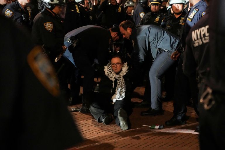 Pro-Palestinian protesters gather near an area where people were being taken into custody near the Columbia University