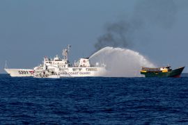 Chinese coastguard vessels fire water cannon towards a Philippine vessel on its way to a resupply mission at Second Thomas Shoal in the South China Sea [File: Adrian Portugal/Reuters]