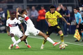 Paris St Germain&#039;s Bradley Barcola in action with Borussia Dortmund&#039;s Jadon Sancho [Leon Kuegeler /Reuters]