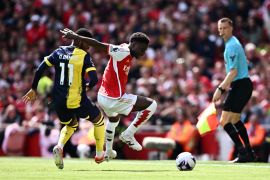 Arsenal&#039;s Bukayo Saka in action with AFC Bournemouth&#039;s Dango Ouattara [Dylan Martinez/Reuters]