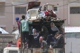 People flee the eastern parts of Rafah [Hatem Khaled/Reuters]