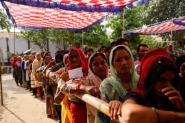 People queue to vote at a polling station during the third phase of the election, in Sambhal district of Uttar Pradesh state [Anushree Fadnavis/Reuters]