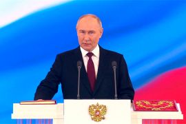 Russian President Vladimir Putin takes an oath during his inauguration ceremony at the Kremlin. [Handout/Kremlin.ru via Reuters]