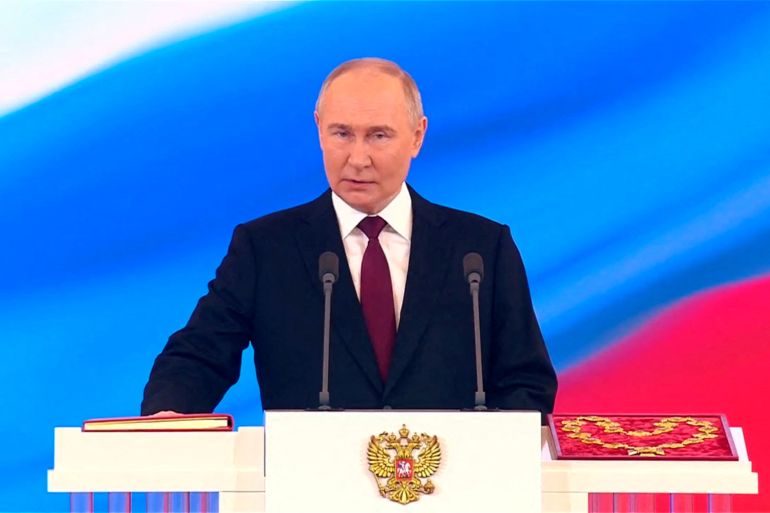 Russian President Vladimir Putin takes the oath during an inauguration ceremony at the Kremlin