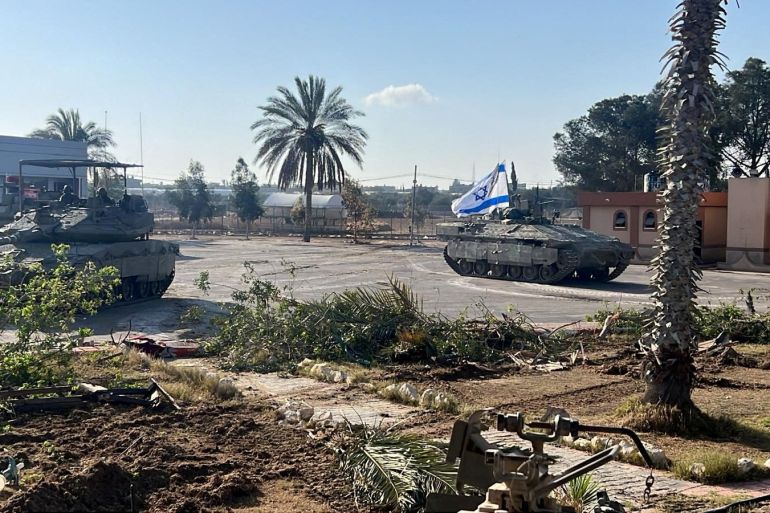 Israeli military vehicles operate in the Gazan side of the Rafah Crossing, amid the ongoing conflict between Israel and Palestinian Islamist group Hamas, in the southern Gaza Strip, in this handout image released on May 7, 2024. Israel Defense Forces/Handout via REUTERS THIS IMAGE HAS BEEN SUPPLIED BY A THIRD PARTY TPX IMAGES OF THE DAY