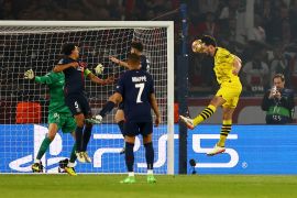 Borussia Dortmund&#039;s Mats Hummels scores the first goal at PSG [Kai Pfaffenbach/Reuters]