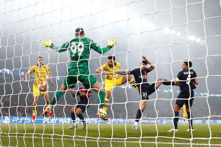 Borussia Dortmund's Mats Hummels scores their first goal past Paris St Germain's Gianluigi Donnarumma