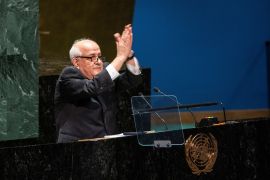Palestinian Ambassador to the United Nations Riyad Mansour gestures to delegates [Eduardo Munoz/Reuters]