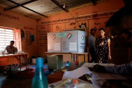 People walk inside a polling station during the fourth phase of the general election, in Beed, Maharashtra, India, [Francis Mascarenhas/Reuters]